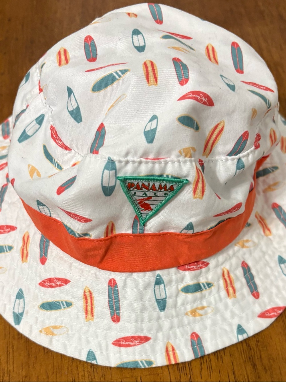 Panama Jack White Bucket Hat with Orange Band and Multicolor Surf Print